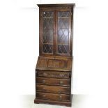 A Wood Brothers style linen-fold panelled elevated bookcase,