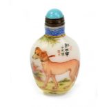 A Chinese 20th century glass scent bottle painted in enamels with two dogs in garden landscape and