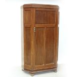A c1930 mahogany panelled hall robe with canted corners,