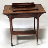 An Edwardian rosewood bonheur du jour with elevated stationery compartment and writing surface