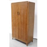 A c1960s Lebus oak two-door wardrobe,