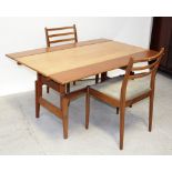 A Scandinavian-style metamorphic drop-leaf dining table/coffee table on rise-and-fall mechanism
