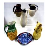 Five ceramic jugs to include one in the form of a pig,