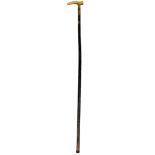 A late Victorian swagger stick/short cane with rhinoceros horn handle and remnants of ebonising to