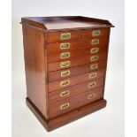 An early 20th century mahogany collectors' chest of eight graduated drawers to a plinth base,