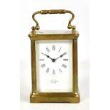 A circa 1900 French brass carriage clock retailed by Mappin & Webb of London with white enamel