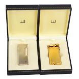 DUNHILL; two cased gold and silver plated cigarette lighters with engine turned finish, also a group