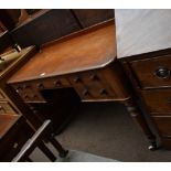 HEAL & SON; a late Victorian mahogany writing desk with rounded rectangular top above five drawers