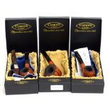 COMOY'S OF LONDON; four pipes comprising no. 4, 5, 6 and 7, the former with silver collar, three