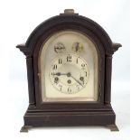 WURTTEMBERG; an ebonised mantel clock, the silvered chapter ring set with Arabic numerals and with