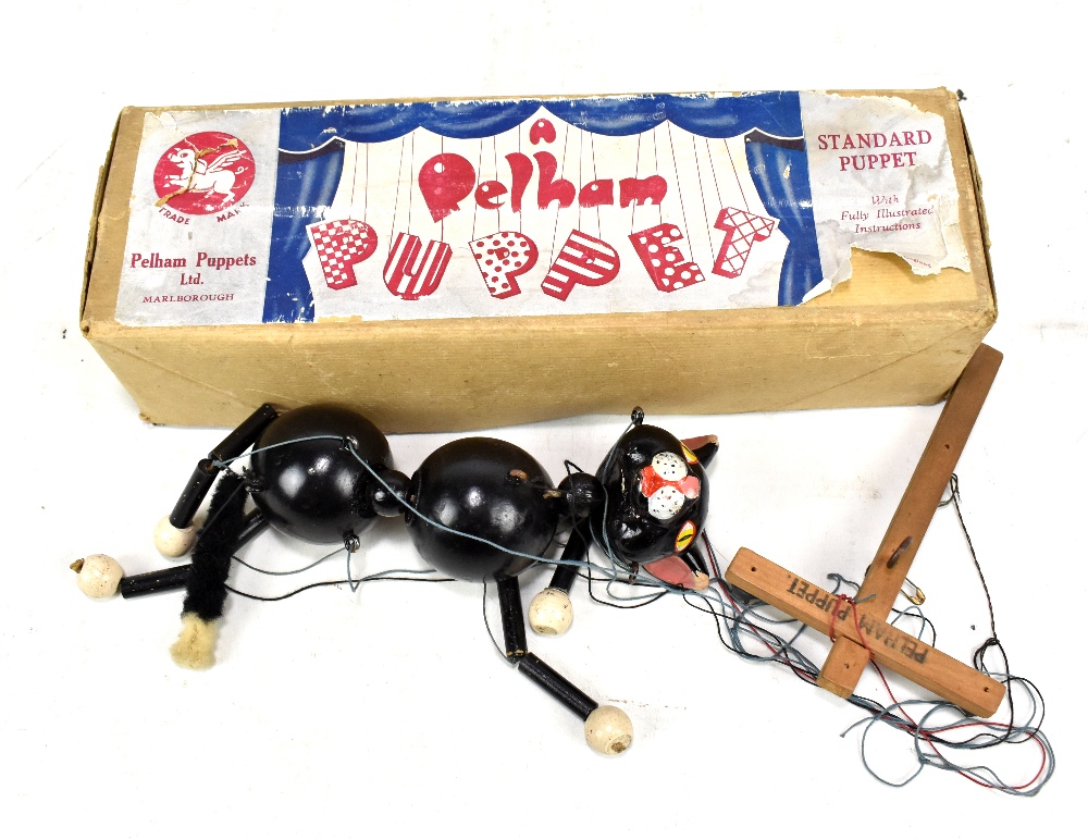 A Pelham cat puppet in associated Pelham box.