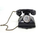A vintage bakelite telephone, height 20cm.