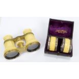 A cased pair of ivory and gilt metal mounted opera glasses in leather case labelled 'J. B. Dancer