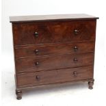 A Victorian mahogany chest of four long drawers raised on turned feet.