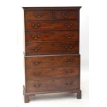 A late George III mahogany chest on chest, the upper section with moulded cornice above two short