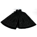 An early 20th century lady's black velvet and silk cape, length approx 86cm