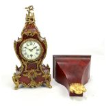 A late 19th century gilt metal and tortoiseshell mantel clock, the porcelain dial set with Roman and