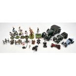 A small group of painted model soldiers and cannons, also four model cars including a Minichamps