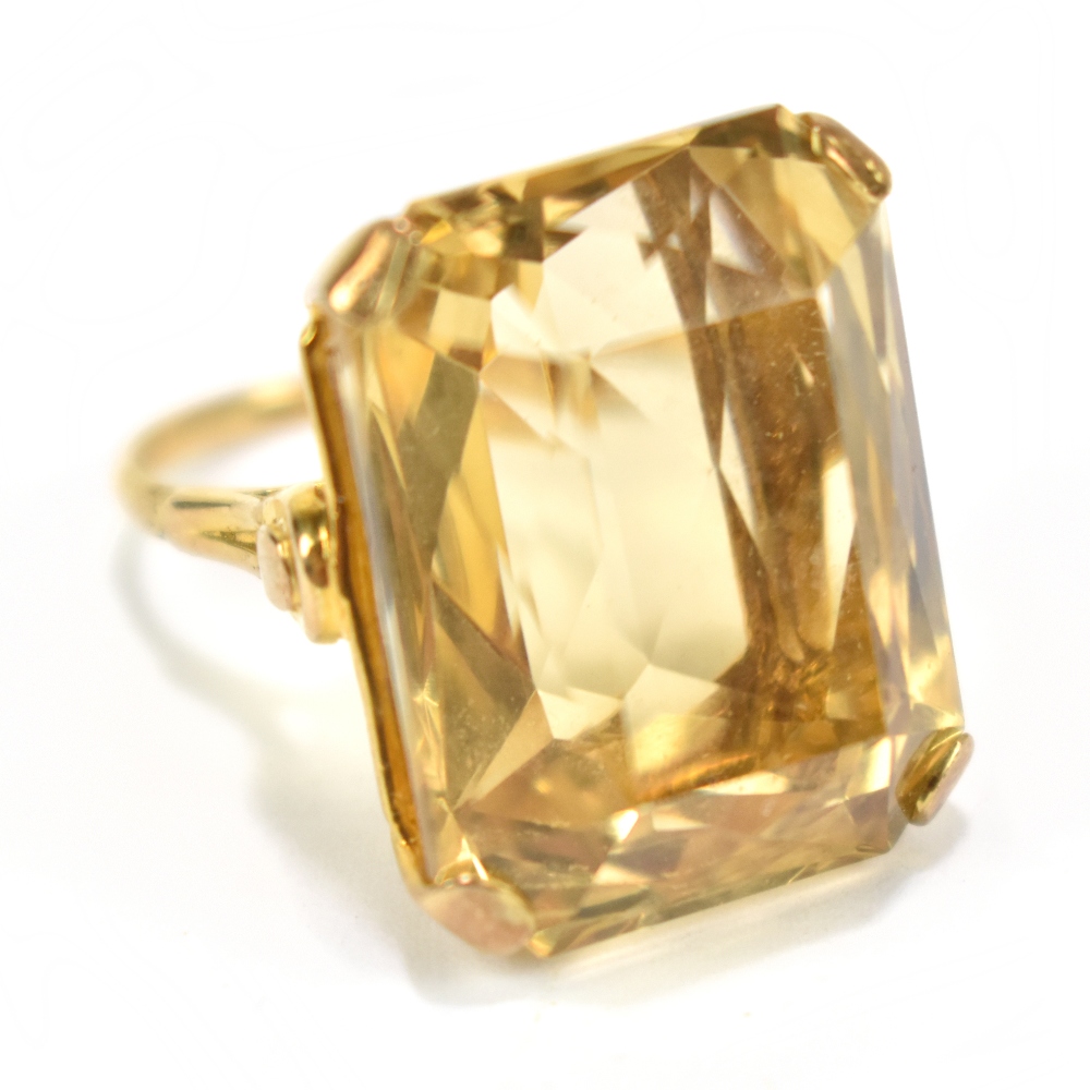 A 9ct yellow gold and large citrine set dress ring, size N, approx 13.5g.