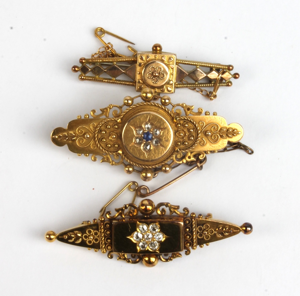 Two Victorian 15ct yellow gold floral motif brooches, both set with white stones and the larger with