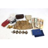 A small group of collectors' items to include banknotes, loose stamps, an evening bag and purse