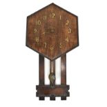 A 1920s oak hexagonal wall clock, length 82c (af).