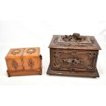 An early 20th century carved beech Black Forest type two division inkwell, width 31cm, and a