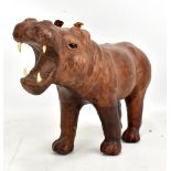 A leather bound model hippo with later resin teeth in the manner of Liberty, length approx 33cm.