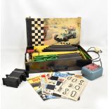 A boxed Scalextric GP33 set including three cars, track and transformer, playworn.