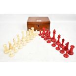 A Victorian ivory and stained ivory chess set, height of king 8.5cm, in green baize lined mahogany