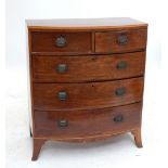 A Victorian mahogany bowfronted chest of drawers (badly af), width 124cm.