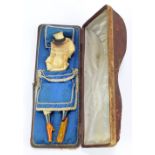 An unusual late Victorian cased carved Meerschaum pipe modelled as a scantily young lady with