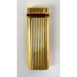 CARTIER; a ribbed lighter with band of enamel decoration and stamped to base 'Cartier Paris 55001V',