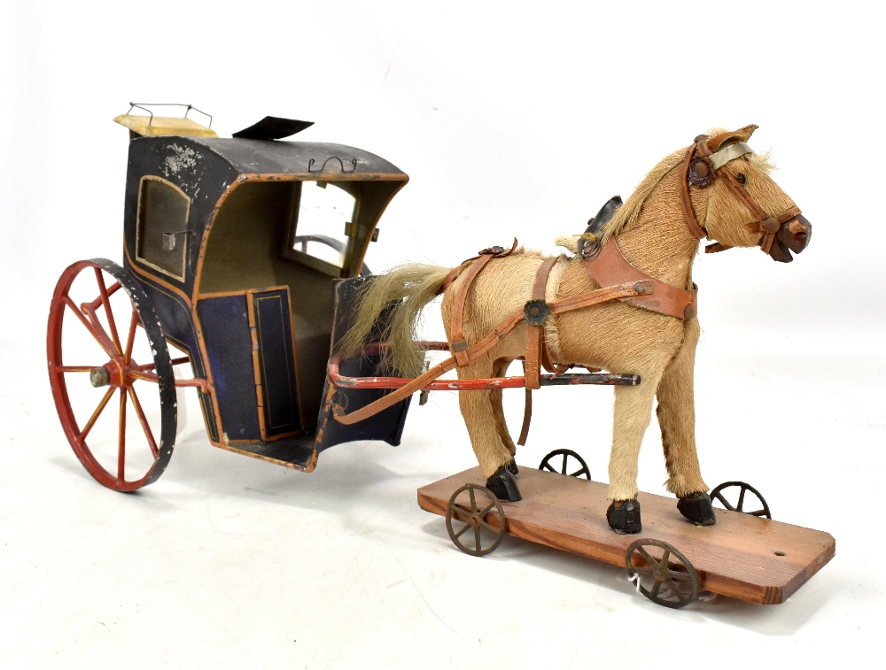 A rare 19th century horse drawn German coach, the tin painted coach set with eight spoke wheels