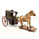 A rare 19th century horse drawn German coach, the tin painted coach set with eight spoke wheels
