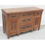A stripped Victorian walnut sideboard with triple frieze drawers over a twin bank of drawers