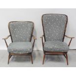 A set of Ercol 'His and Hers' cottage armchairs in mid stained beech with floral blue ground loose