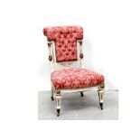 A late Victorian later painted Neo-Classical nursing chair with deep button scroll back,