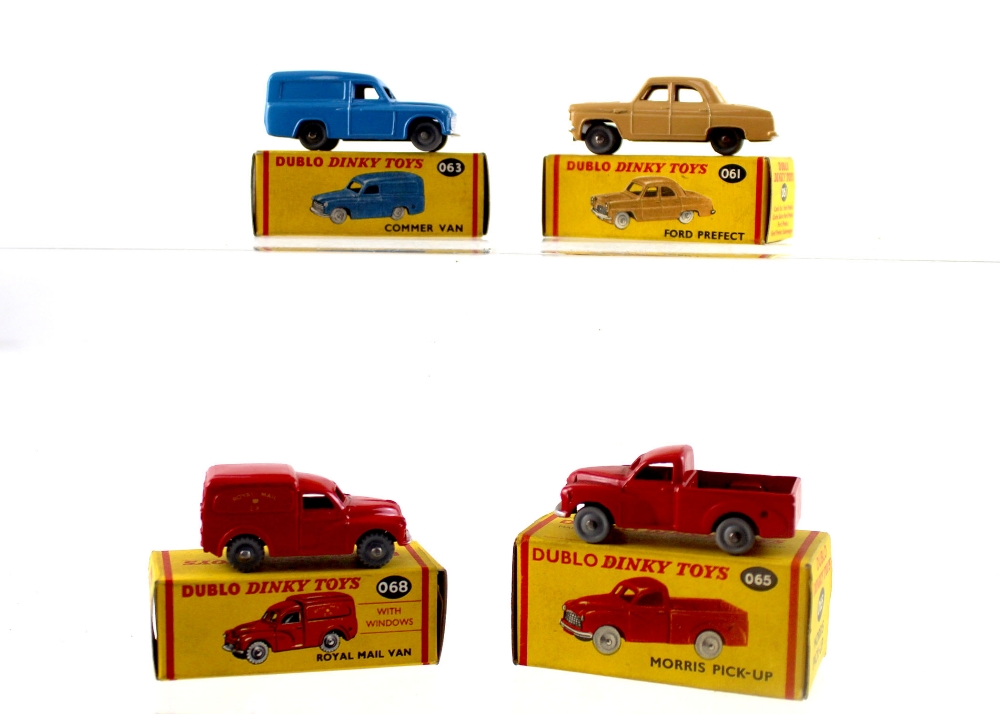 A group of four Dublo Dinky Toys small diecast vehicles to include 063 Commer Van,