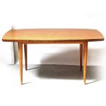 A 1960s faux wood melamine veneered kitchen table on oval tapering legs, length 150cm.