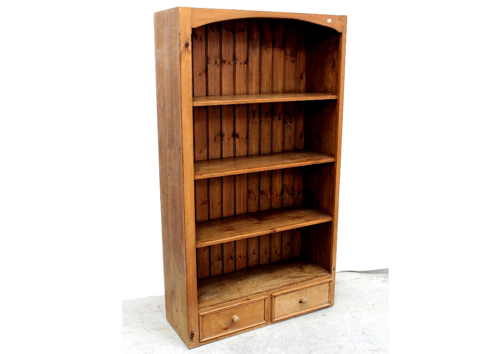 A modern pine floor-standing set of bookshelves with two-drawer base, height 180.5cm.