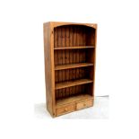 A modern pine floor-standing set of bookshelves with two-drawer base, height 180.5cm.