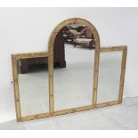 A contemporary gilt-framed triple wall mirror with central arch panel flanked on either side by