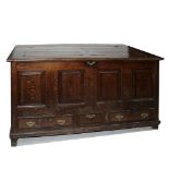 A mid-18th century oak four-panel mule chest,