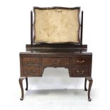 A mid/late 20th century mahogany dressing table, three frieze drawers and two further drawers,