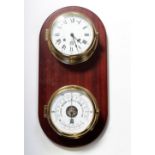 A Sewill's of Liverpool small brass ship's clock the white dial set with Roman numerals and a