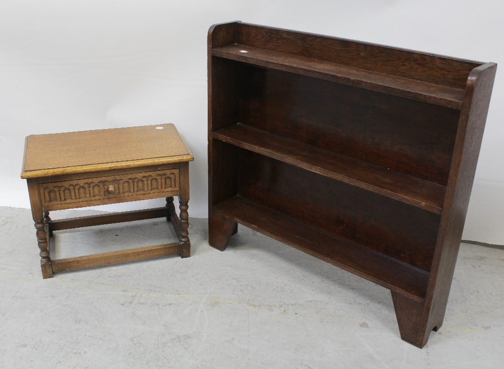 A small modern oak single-drawer side table with egg and dart carved drawer front,