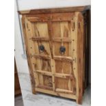 A Mexican hardwood heart and sap wood tallboy cabinet,