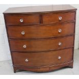 A Laura Ashley style reproduction Georgian bow-front chest of two-over-three drawers with glass