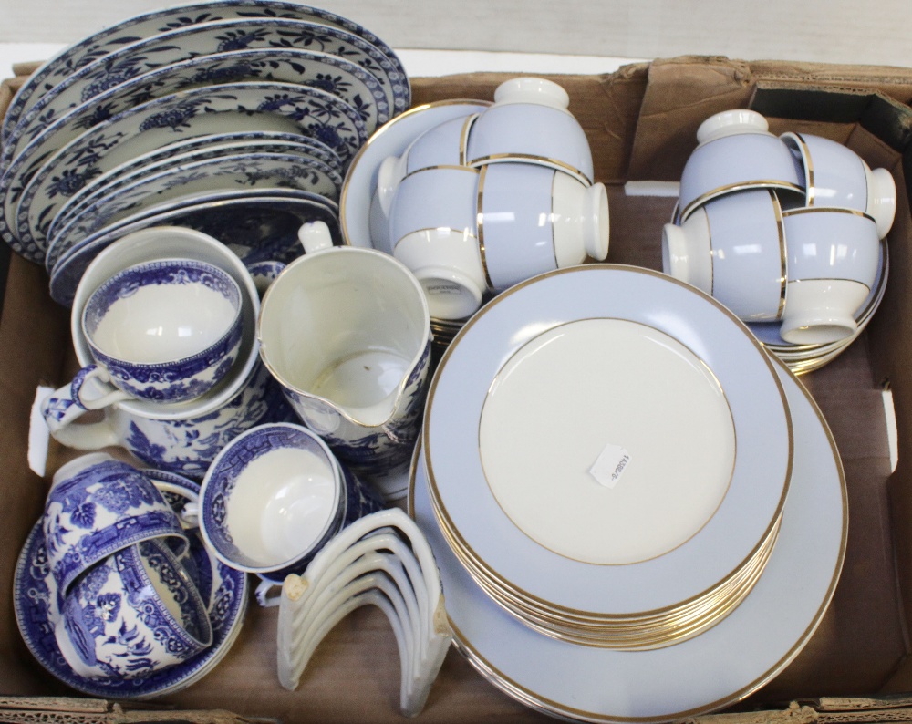 A collection of Doulton blue banded dinner and tea ware comprising eight cups and saucers,